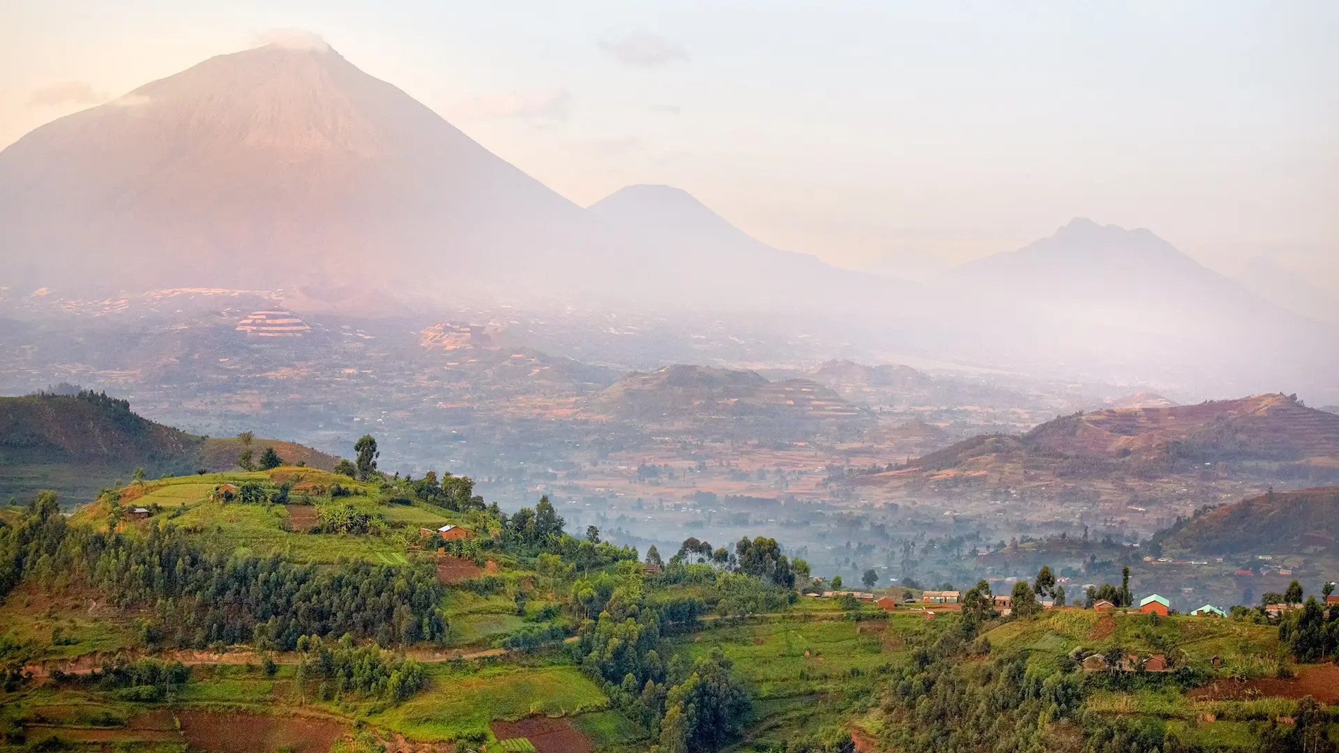 view of virunga volcanoes and mgahinga gorilla national park from kisoro