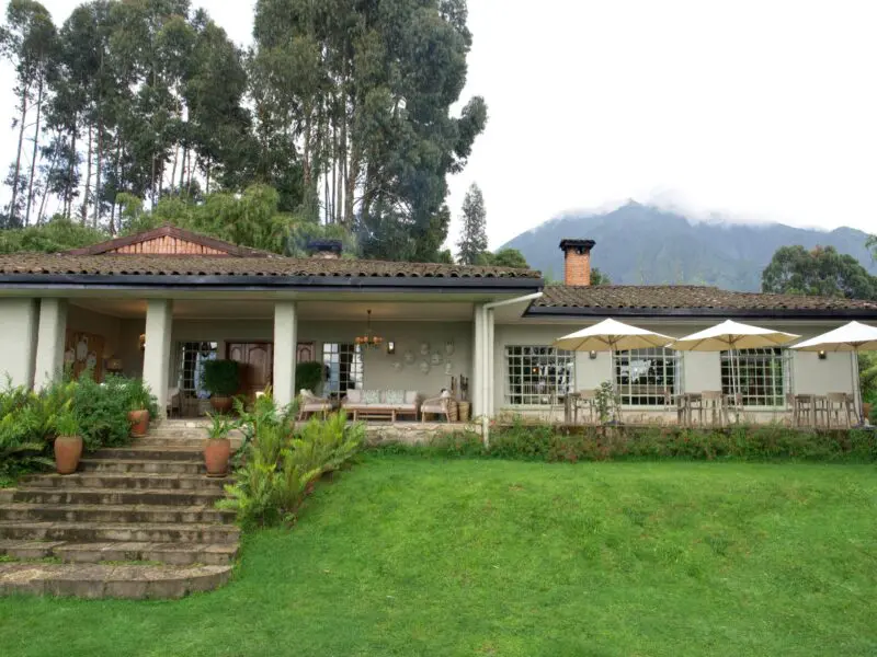 Wilderness Sabyinyo Exterior of the main area with mountains and clouds in the background