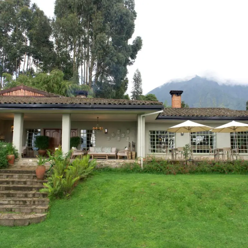 Wilderness Sabyinyo Exterior of the main area with mountains and clouds in the background