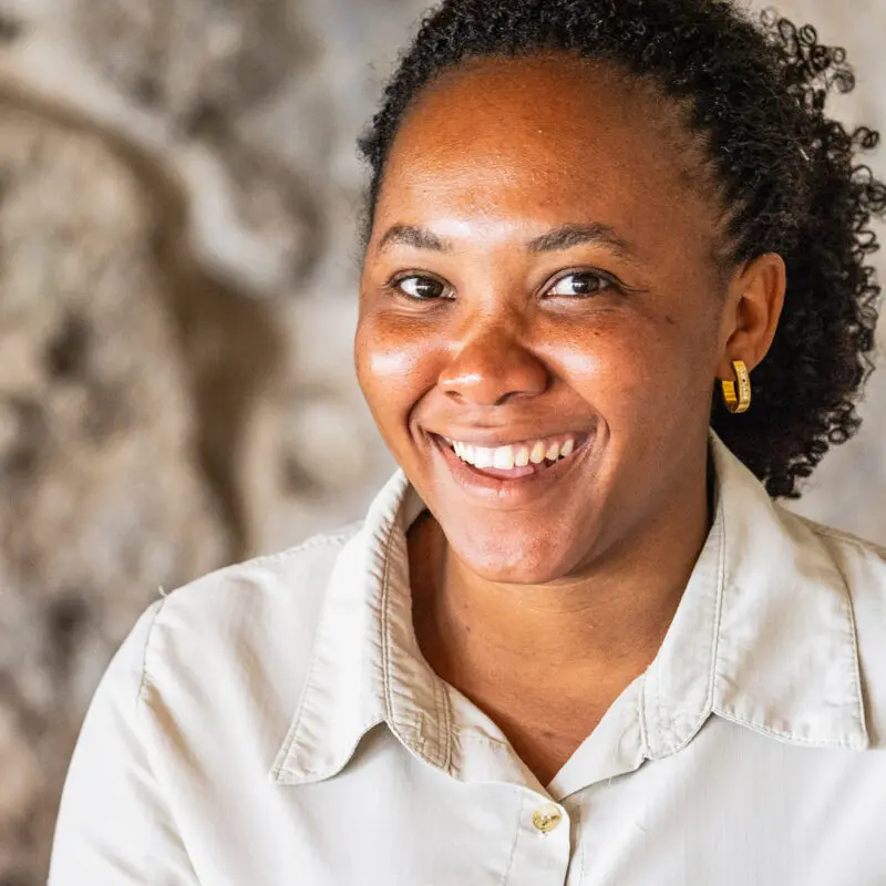 female staff smiling at the camera, namiri plains camp, tanzania, asilia africa