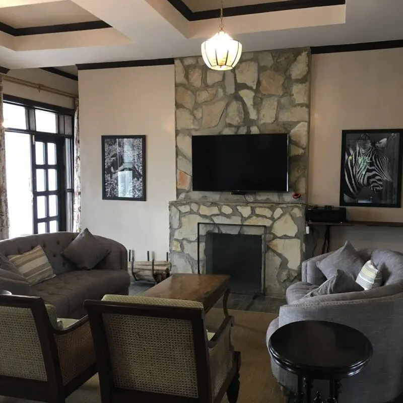 Five Volcanoes Lounge area interior with fireplace and television