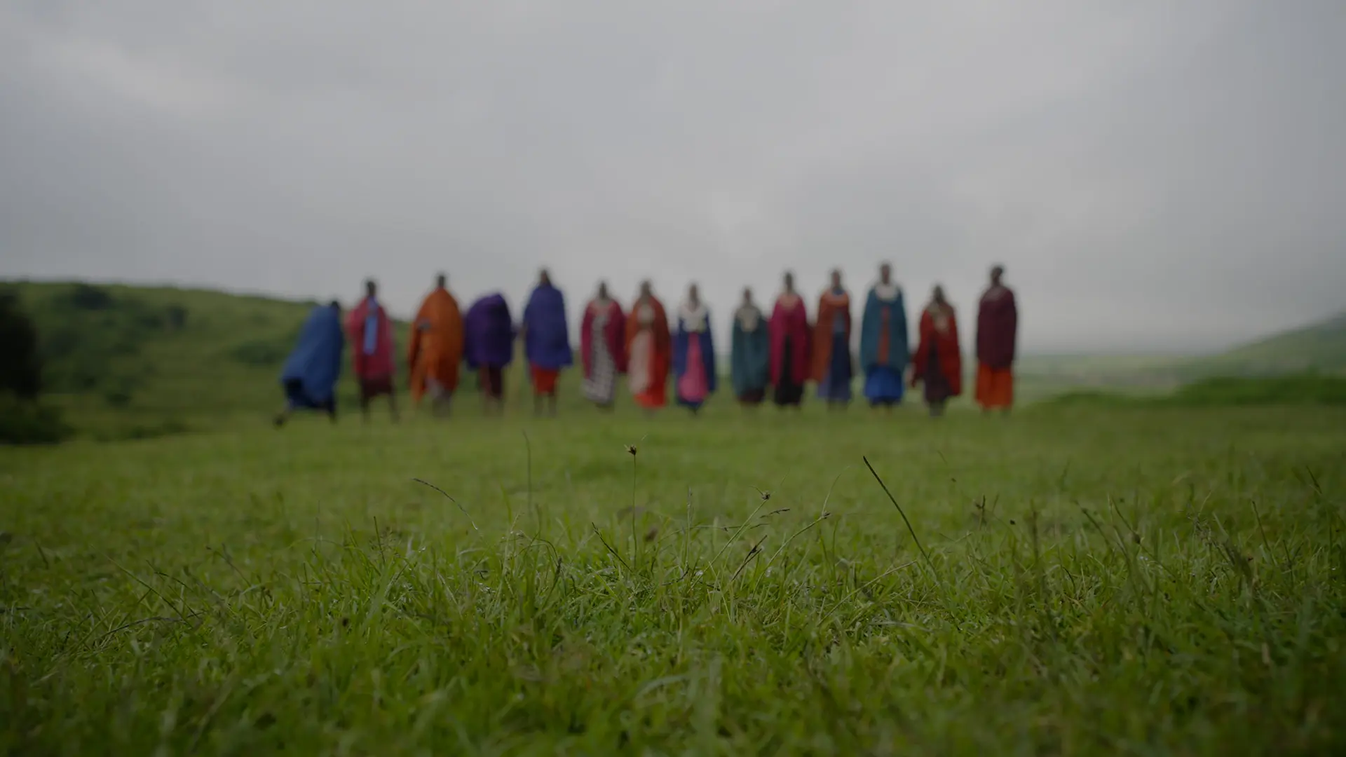 a local african tribe stood in a line in east africa, asilia africa