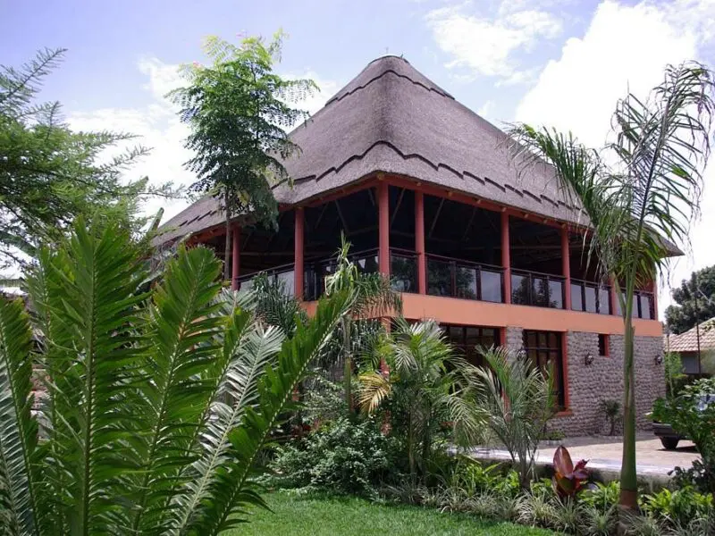 Five Volcanoes Main area exterior surrounded by palm trees and greenery