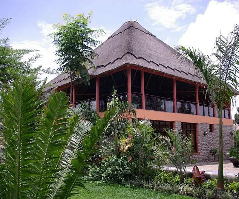 Five Volcanoes Main area exterior surrounded by palm trees and greenery