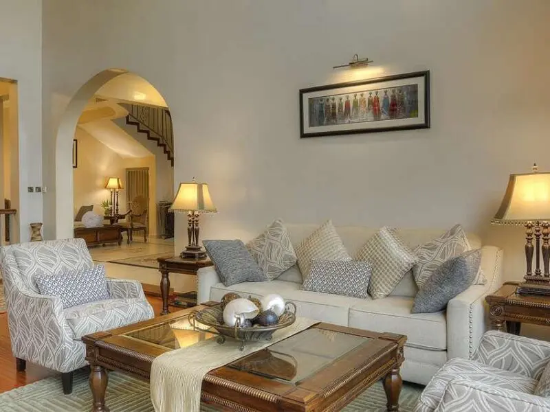 Bishop's House Lounge interior with couches, hanging art and tables