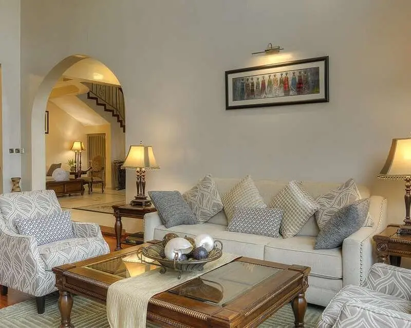 Bishop's House Lounge interior with couches, hanging art and tables