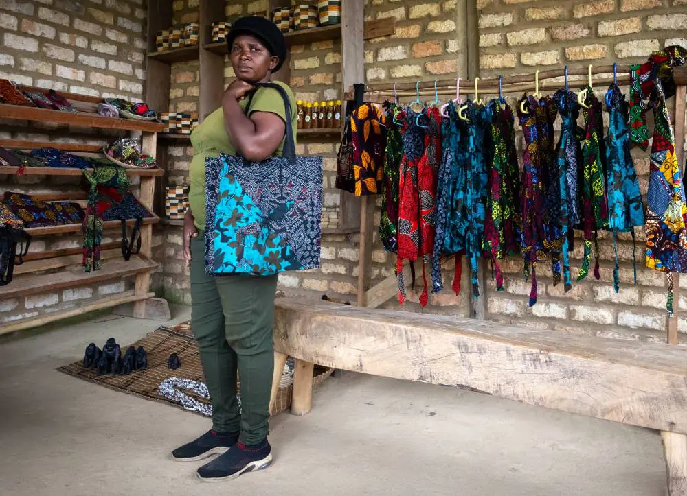 Mama Faith showing off a colourful bag