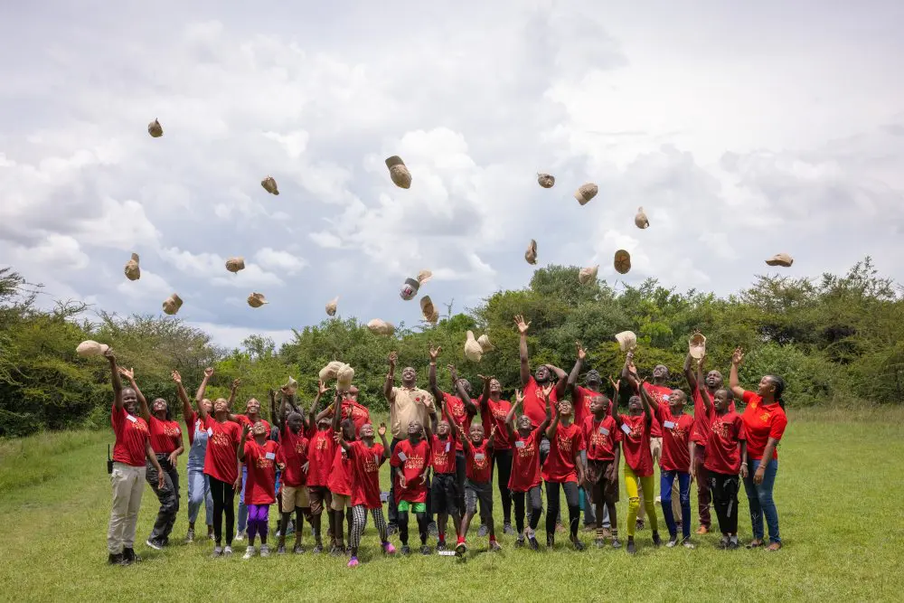 Children and staff celebrate a successful Twende Porini at Encounter Mara, Kenya