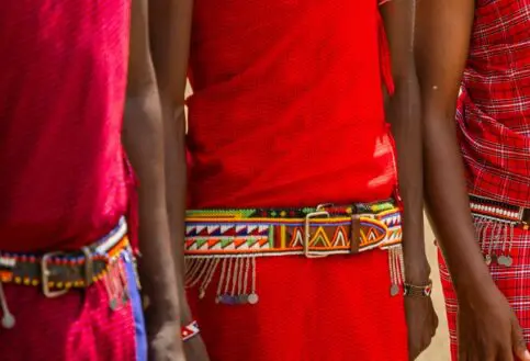 The traditional red shuka and beaded belts of the Maasai.