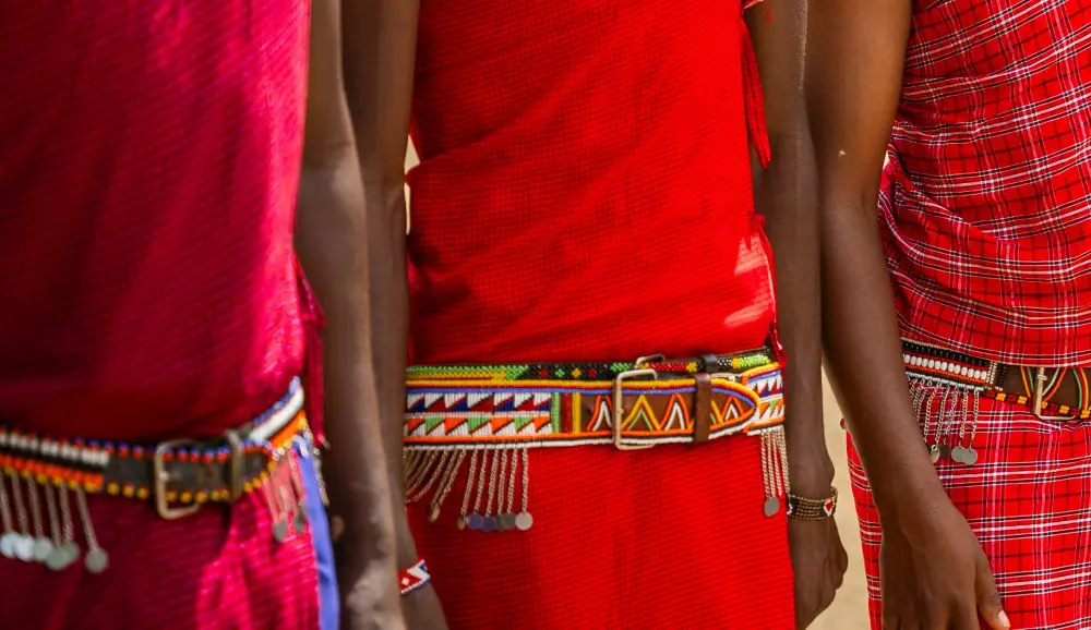 The traditional red shuka and beaded belts of the Maasai.