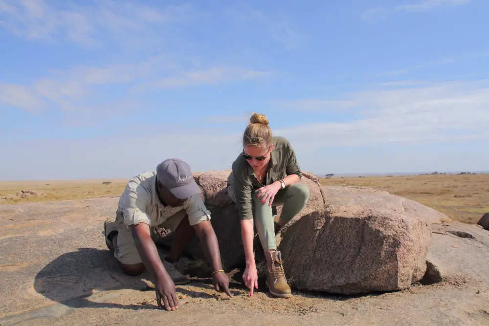 A woman and her guide in the Serengeti National Park, Tanzania.