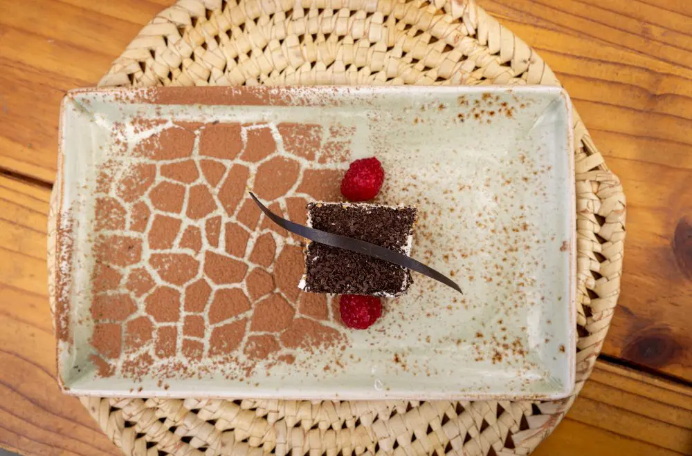 A giraffe print pattern stencilled on a dessert plate.