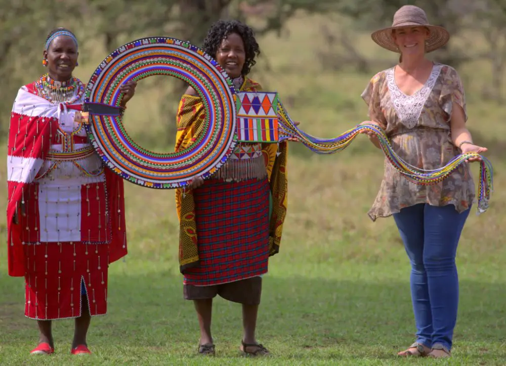 Women holding the Enkarewa after its completion, Mara Naboisho Conservancy.