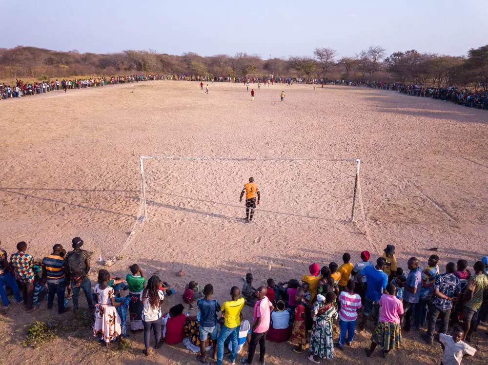 An aerial view down the length of the sandy football pitch, southern Tanzania.