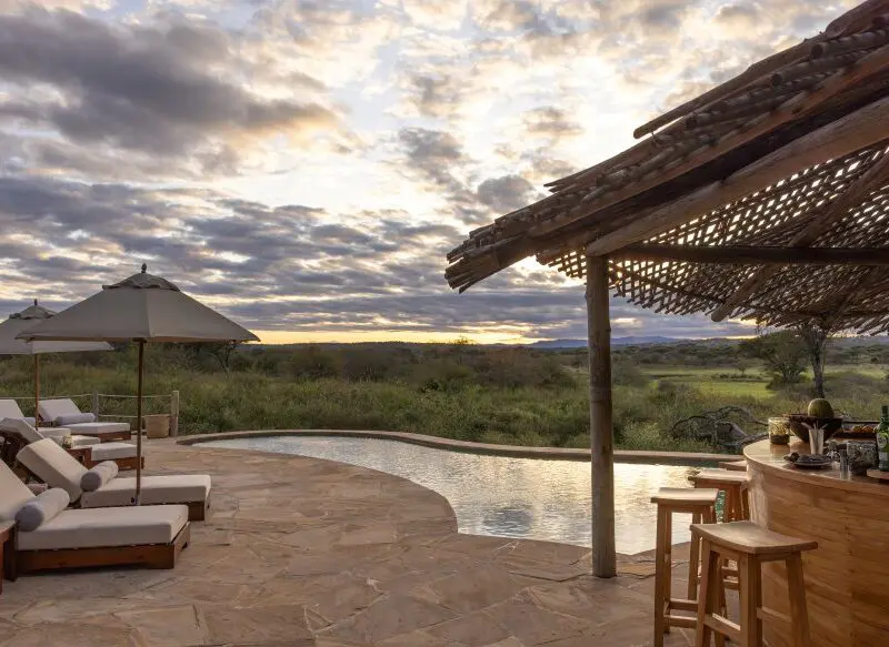 The pool and poolside bar at Oliver's Camp, Tarangire National Park.
