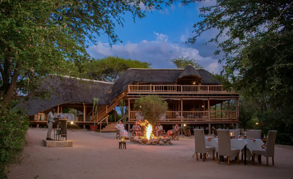 Guests around the campfire in Oliver's Camp, Tarangire National Park.