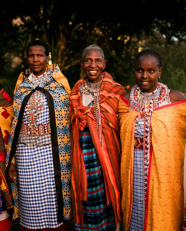 a group of ladies from the Maasai Mara community stand together