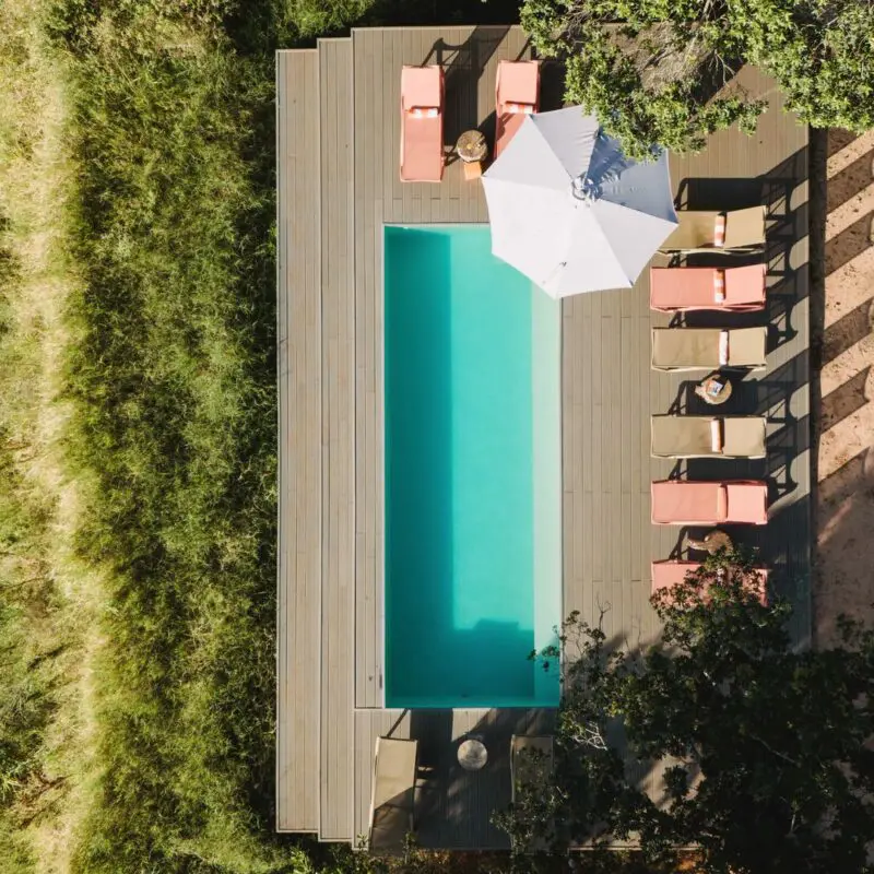 An aerial view of Emboo camp's swimming pool on the Talek river in Kenya