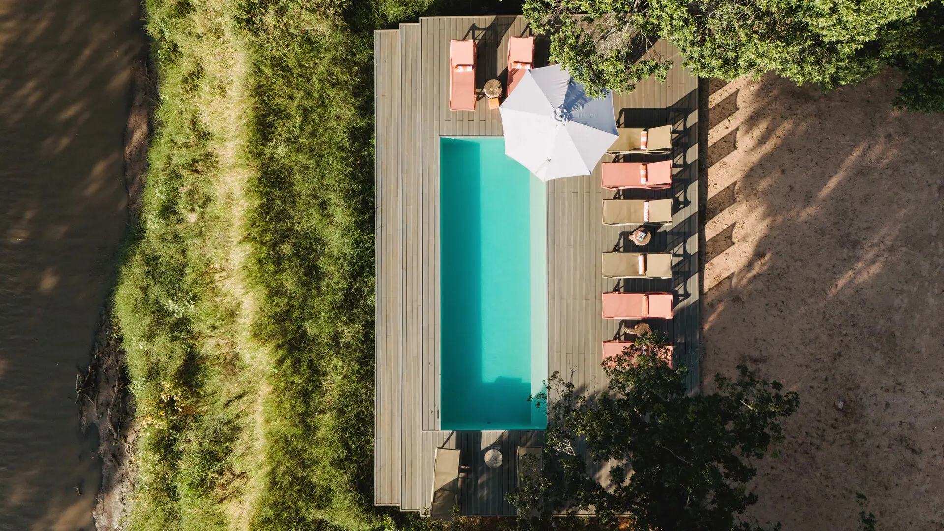 An aerial view of Emboo camp's swimming pool on the Talek river in Kenya