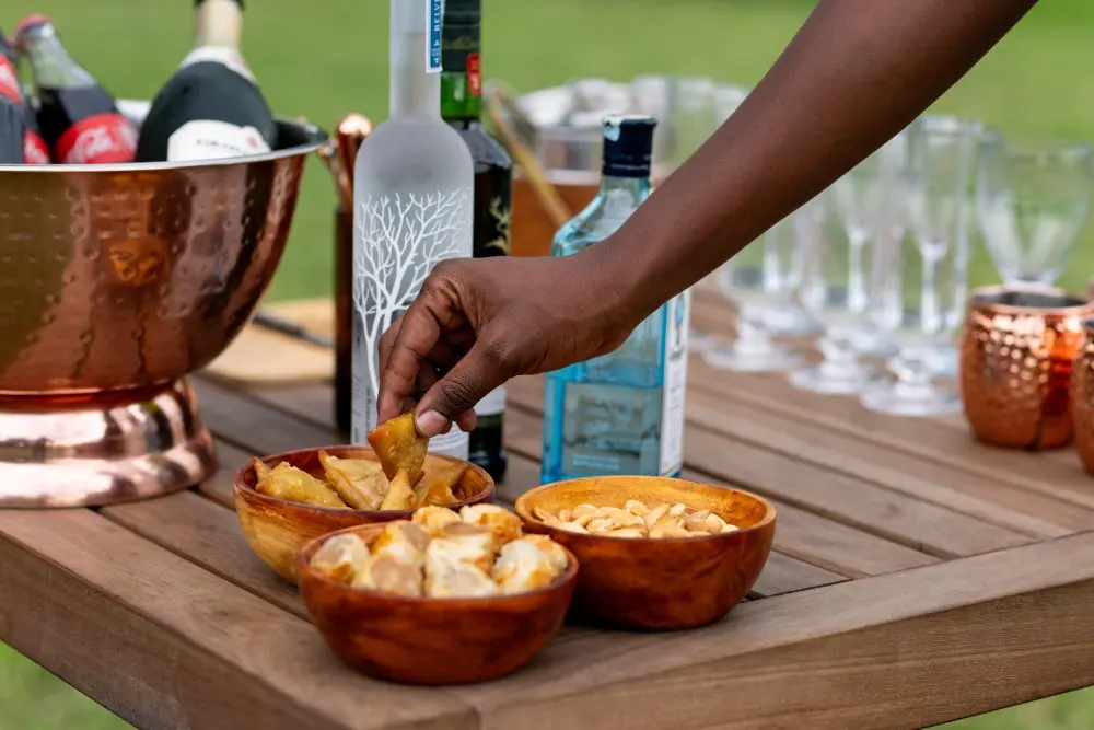 Snacks being served alongside sundowners, Serengeti National Park, Tanzania.