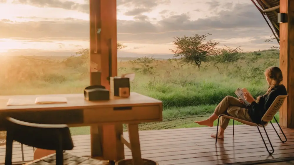 Relaxing on the deck at Naboisho Camp, Mara Naboisho Conservancy, Kenya.