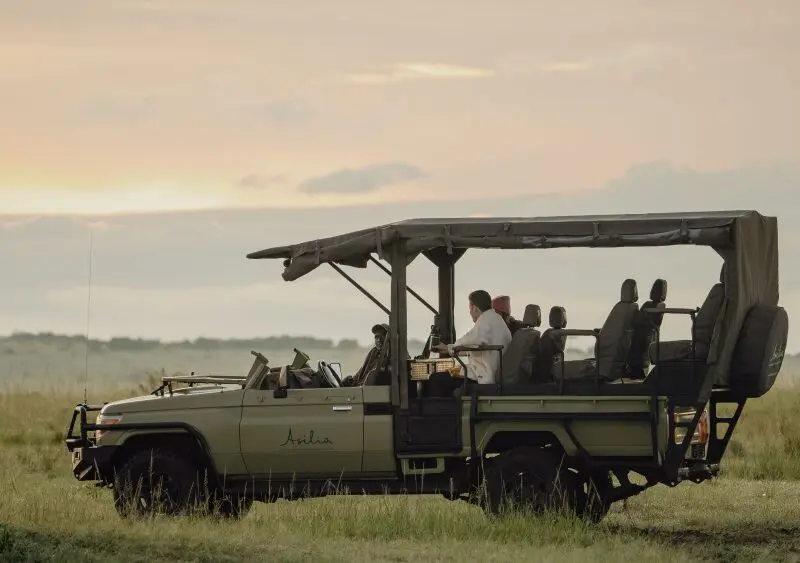 An Asilia e-vehicle, Maasai Mara, Kenya.