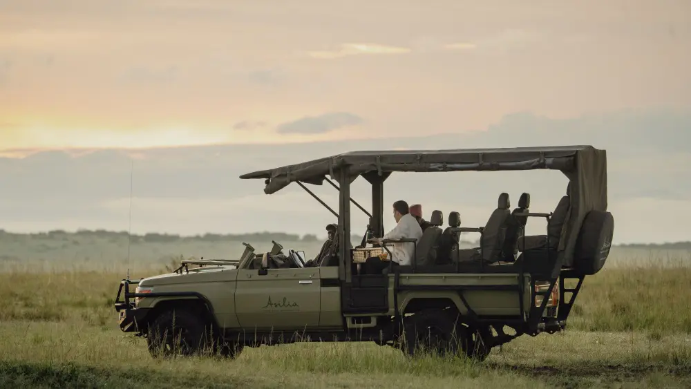 An Asilia e-vehicle, Maasai Mara, Kenya.