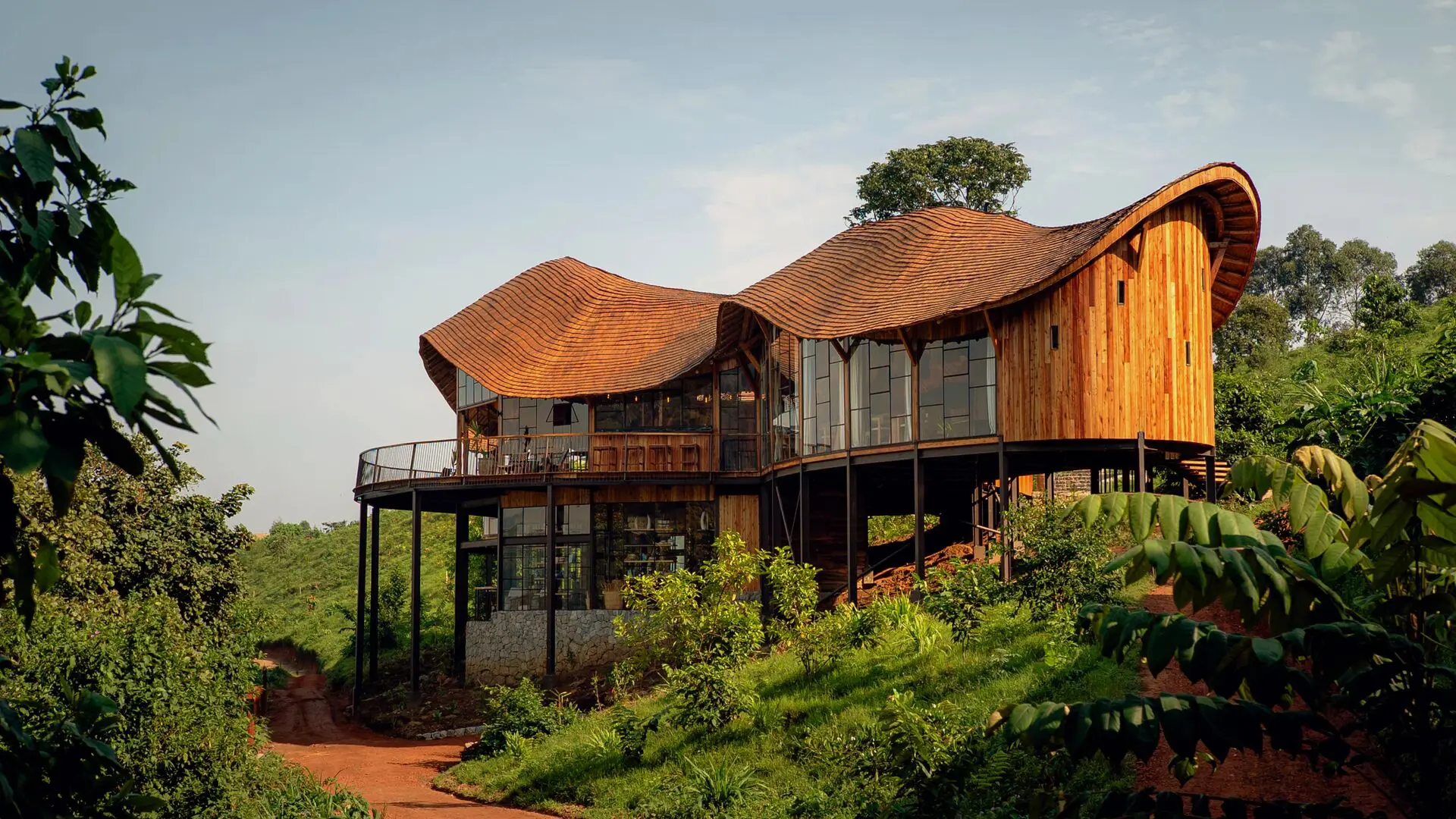 Exterior of the timber-built main area at Erebero Hills, surrounded by lush green vegetation.
