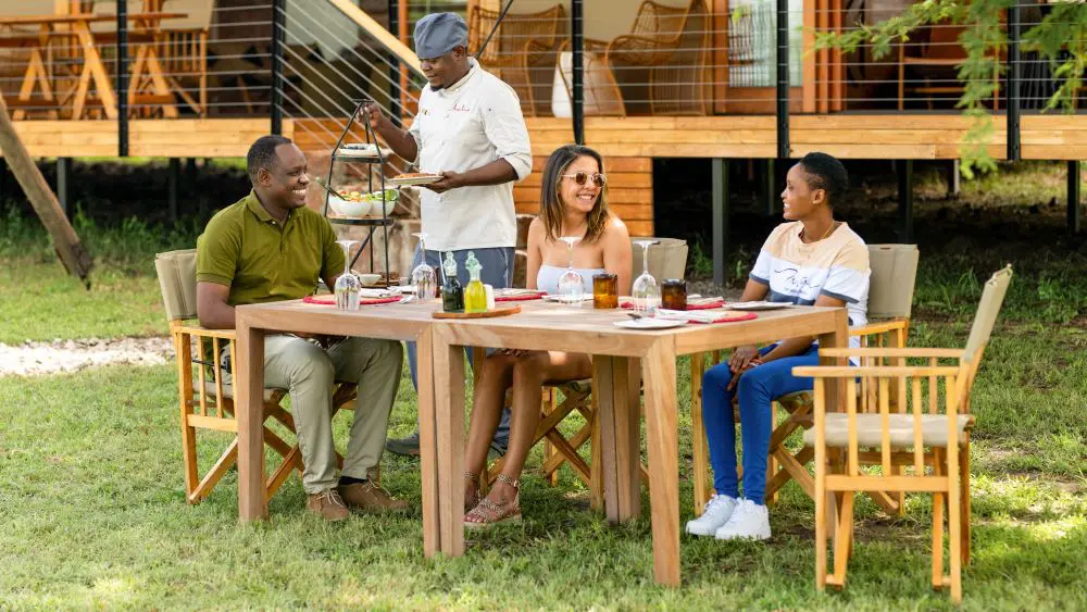 Baraka with guests, Sayari Retreats, Serengeti National Park, Tanzania.