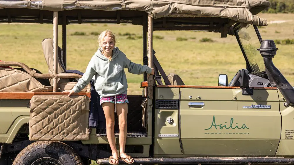 A young girl on safari, Kenya.