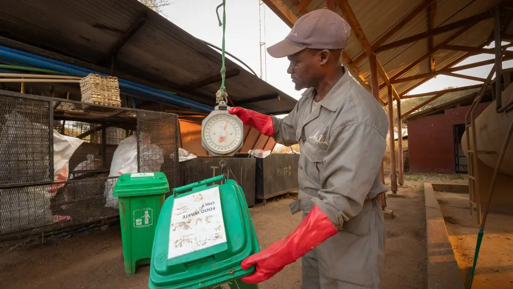 George weighs waste in Oliver's Camp, Tarangire National Park, Tanzania.