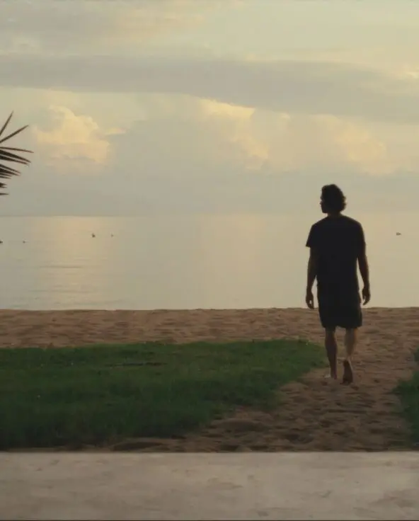 Asilia guest enjoying a stroll on the sandy shores of Rubondo Island