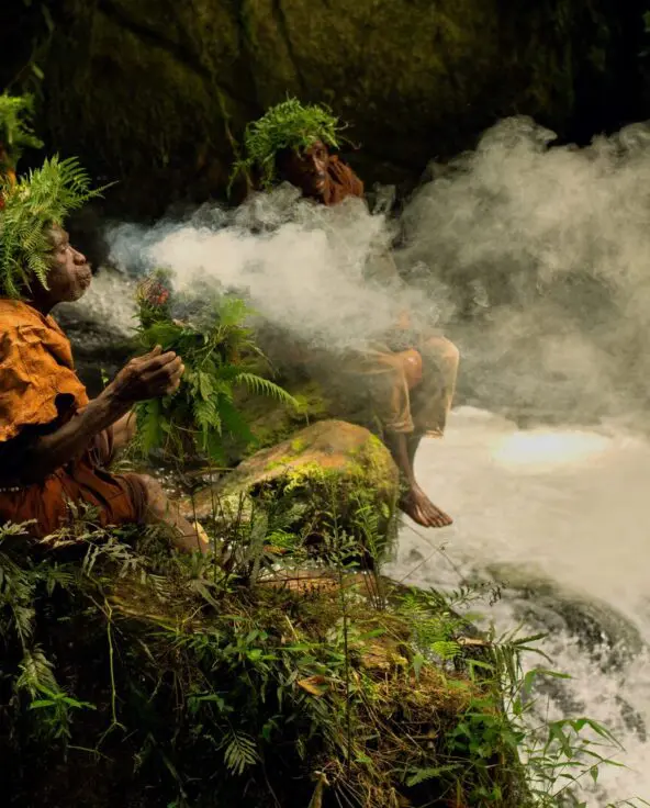 The Batwa burning leaves for protection during a forest walk.