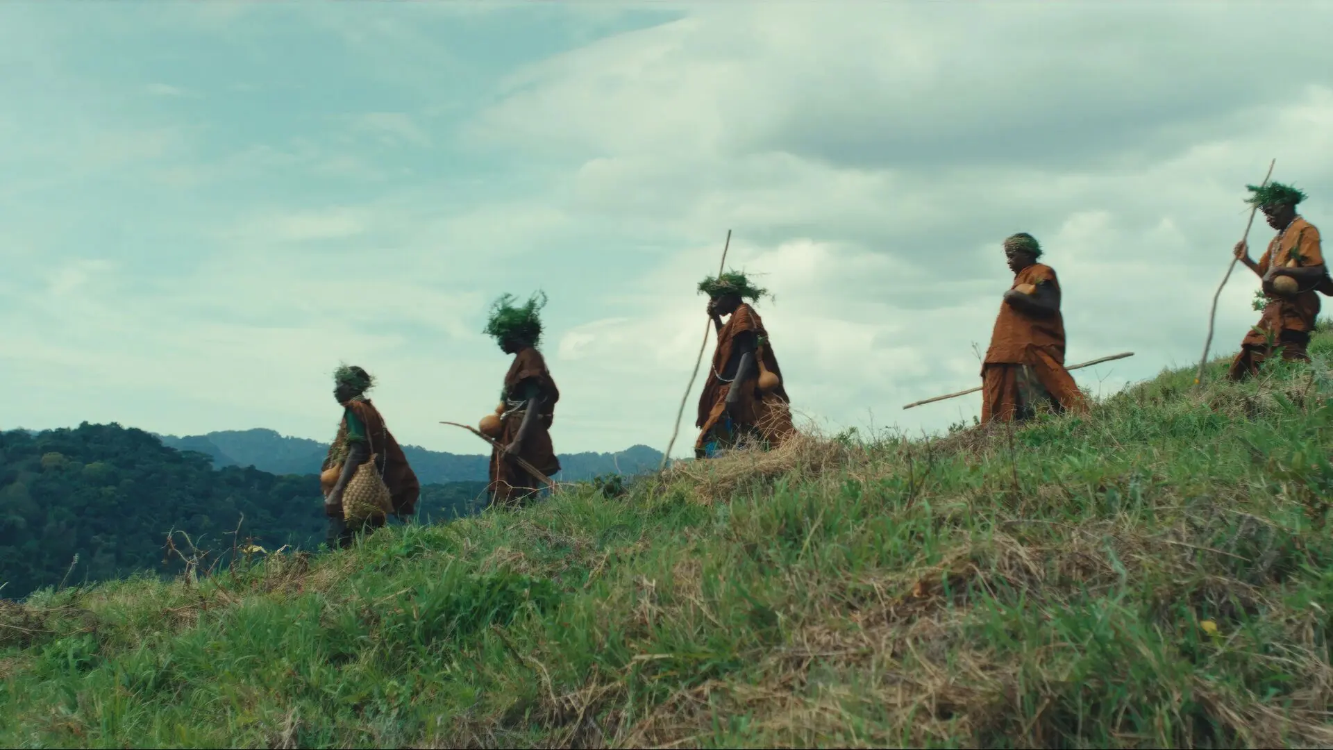 The Batwa people during a walk of the Erebero Hills site.