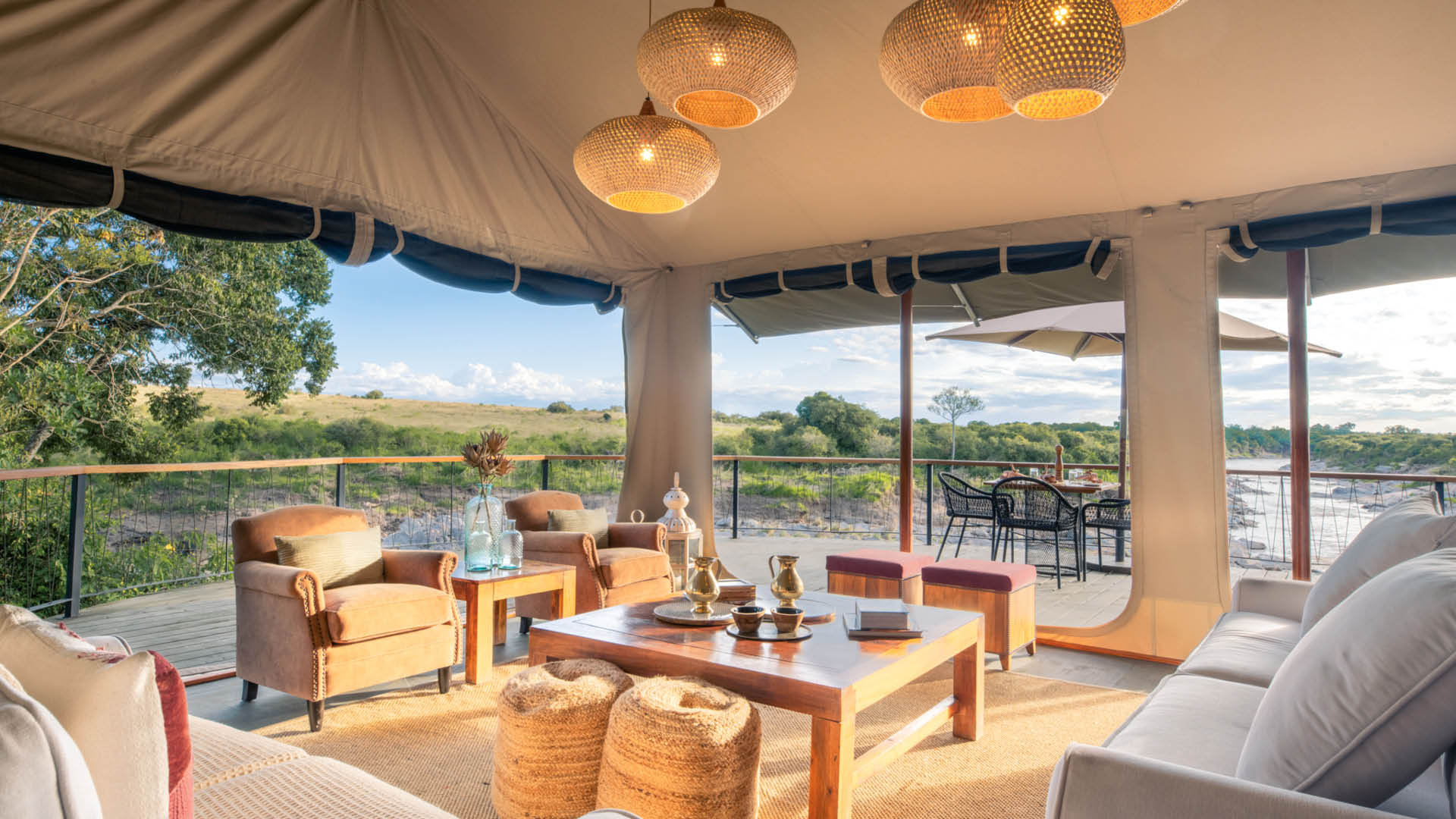 The stylish lounge area at Rekero with comfy sofas, ottomans, and a coffee table