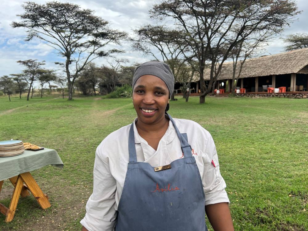 A portrait of Naboisho Camp Head Chef Diana standing outdoors | Asilia Africa