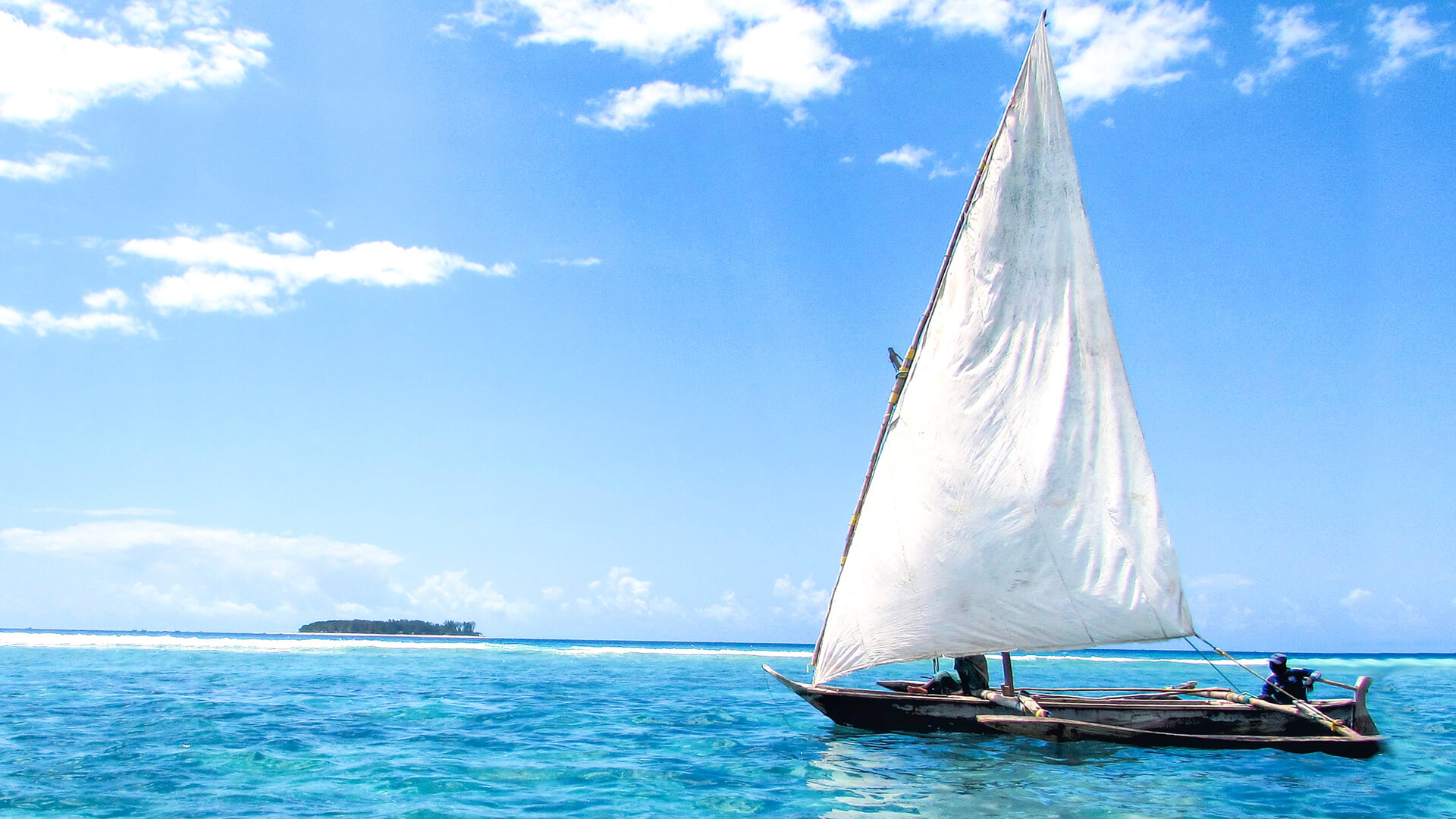 A traditional sailing dhow off the northeast coast of Zanzibar, Tanzania.