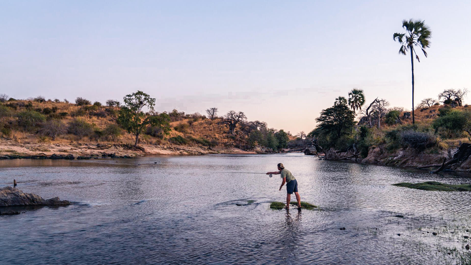 A guest throws a line out on a fishing safari