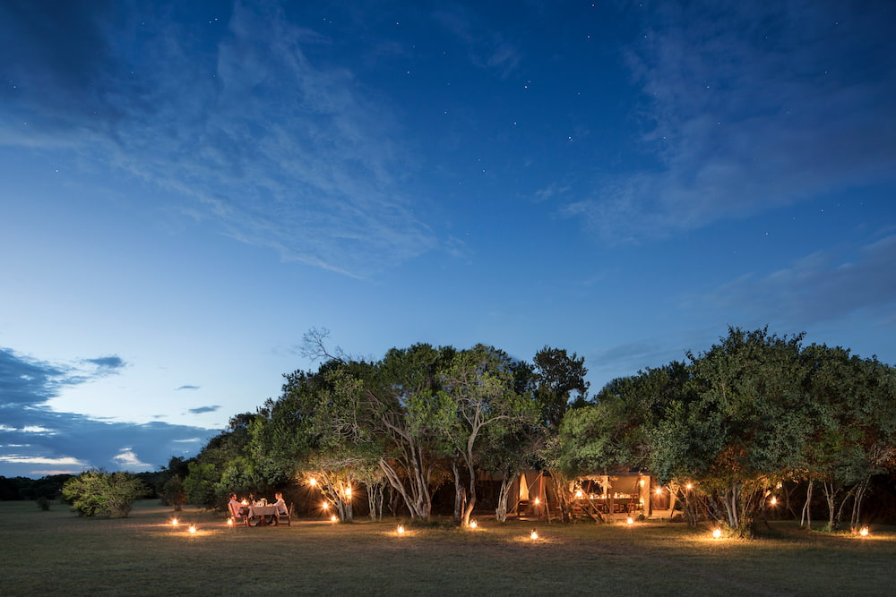 A private dining experience at Encounter Mara Camp.