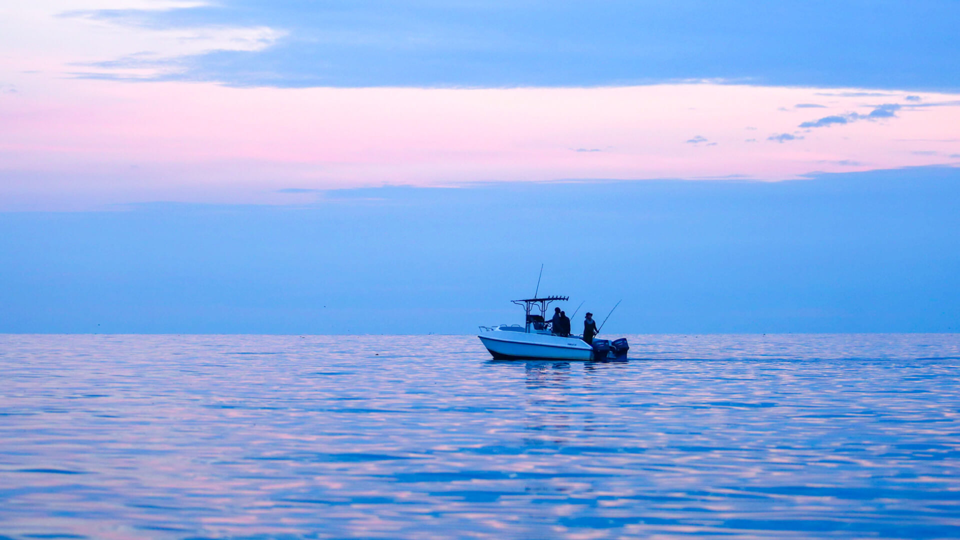 Guests on a fishing safari at sunset