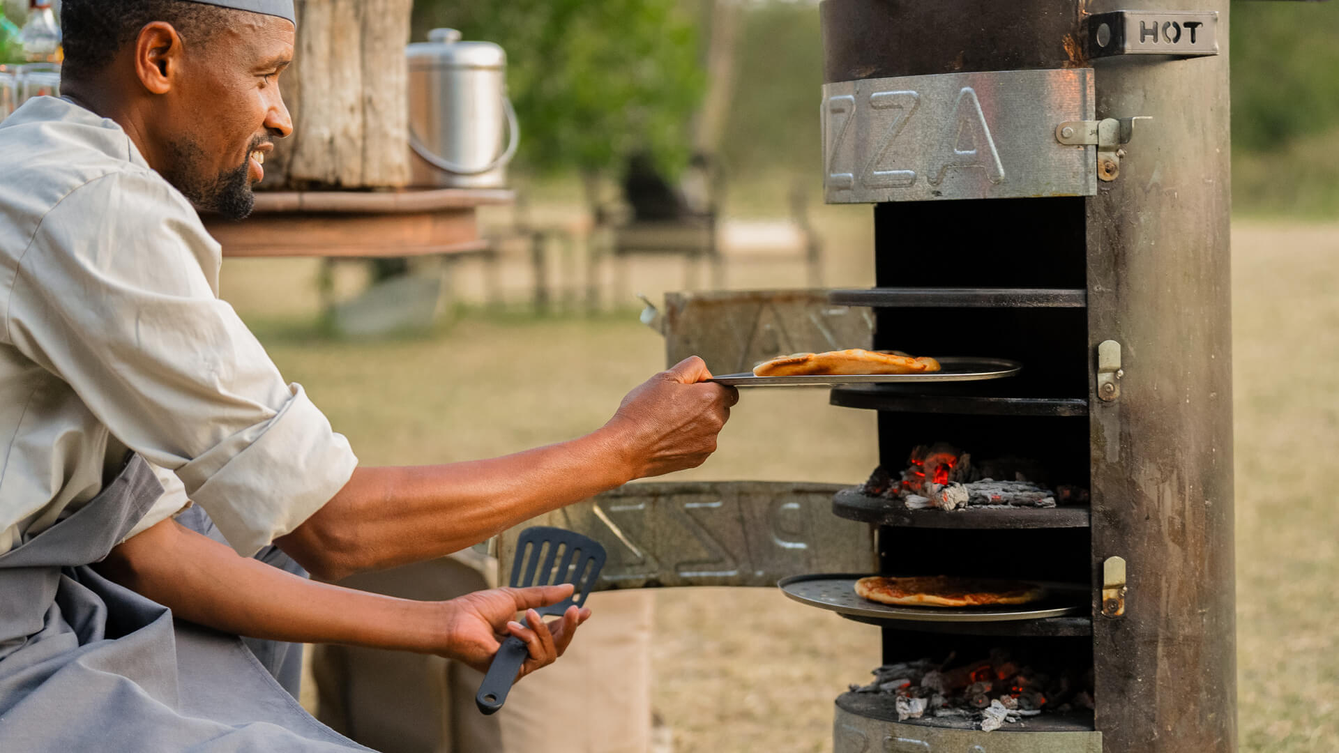 Chef cooking outdoors, Encounter Mara Camp, mara naboisho conservancy, kenya