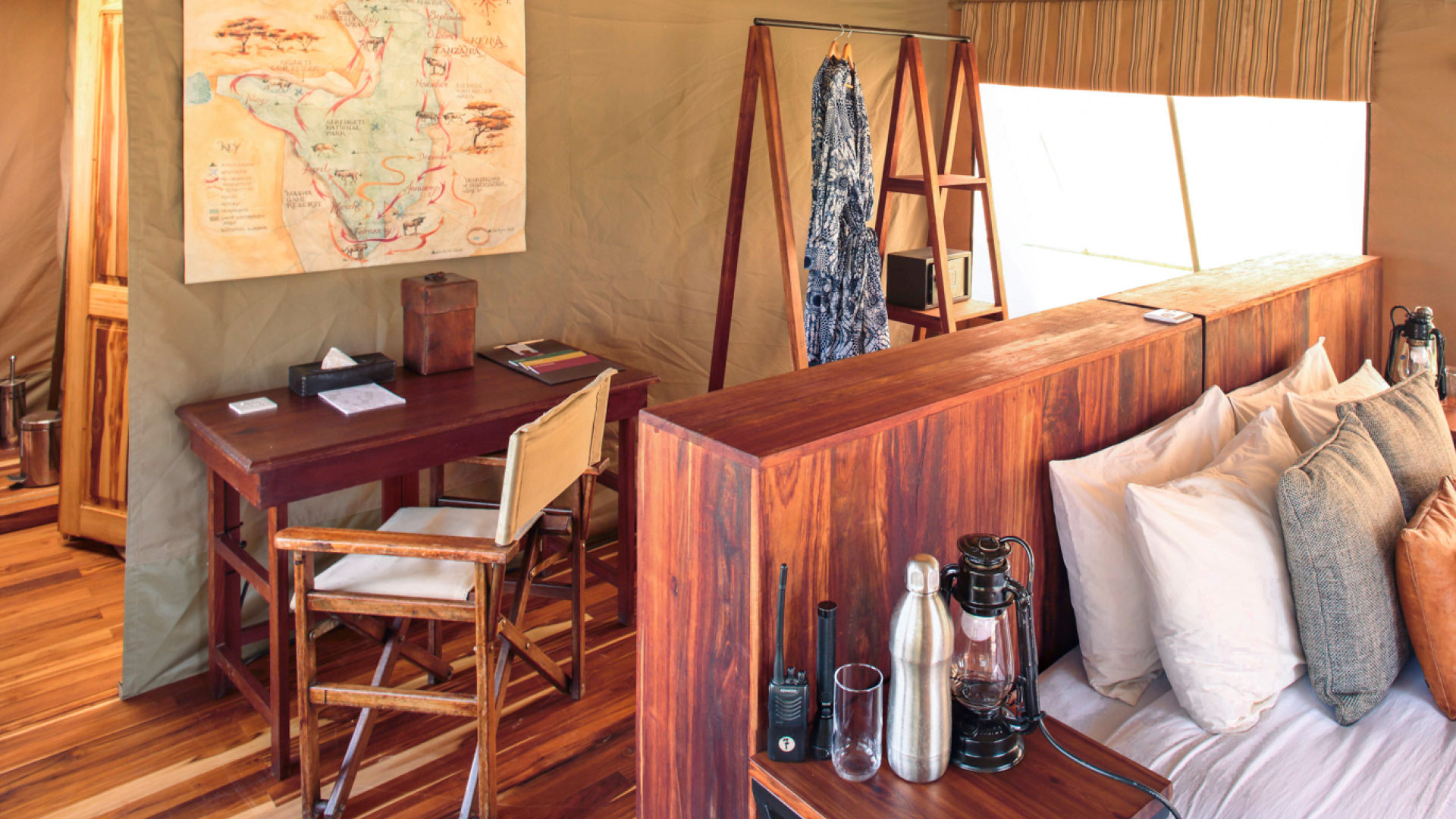 Inside guest tent, desk and back of bed, olakira migration camp, Serengeti National Park, Tanzania
