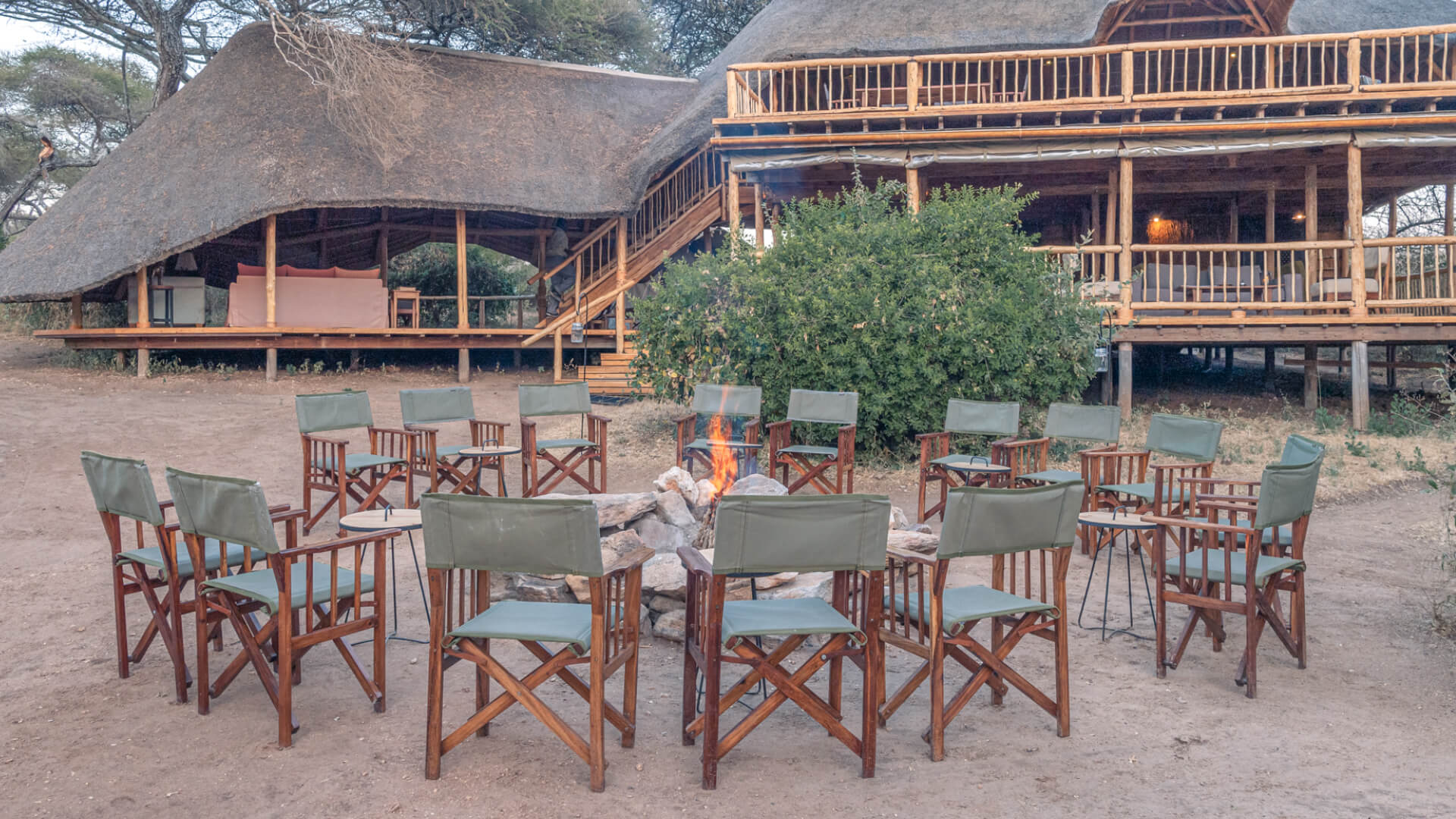 Campfire with sundowner set up at camp, olivers camp, Tarangire National Park, Tanzania