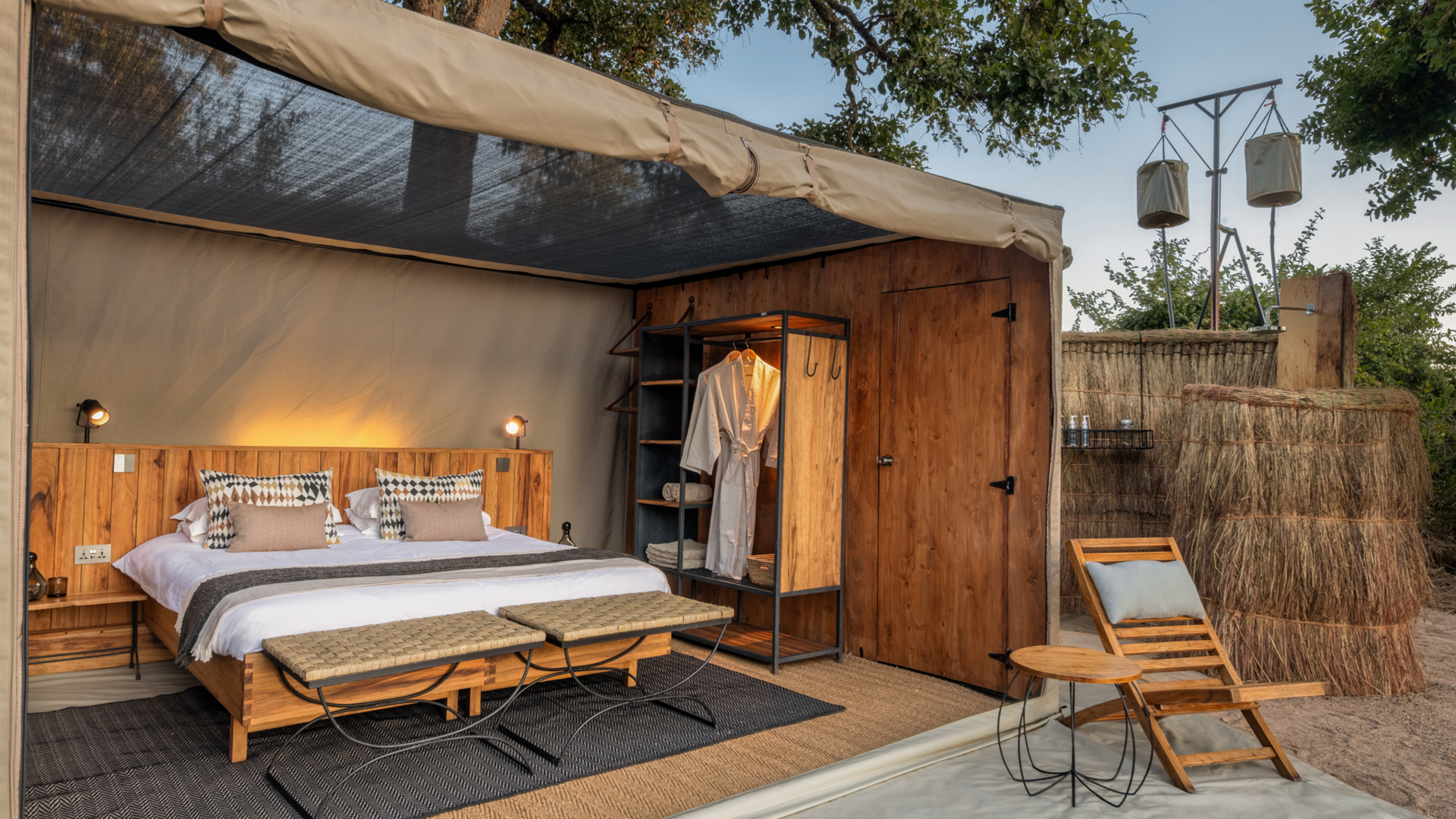 Interior view of a Kokoko tent, showing the roof pulled back and the overhead netting
