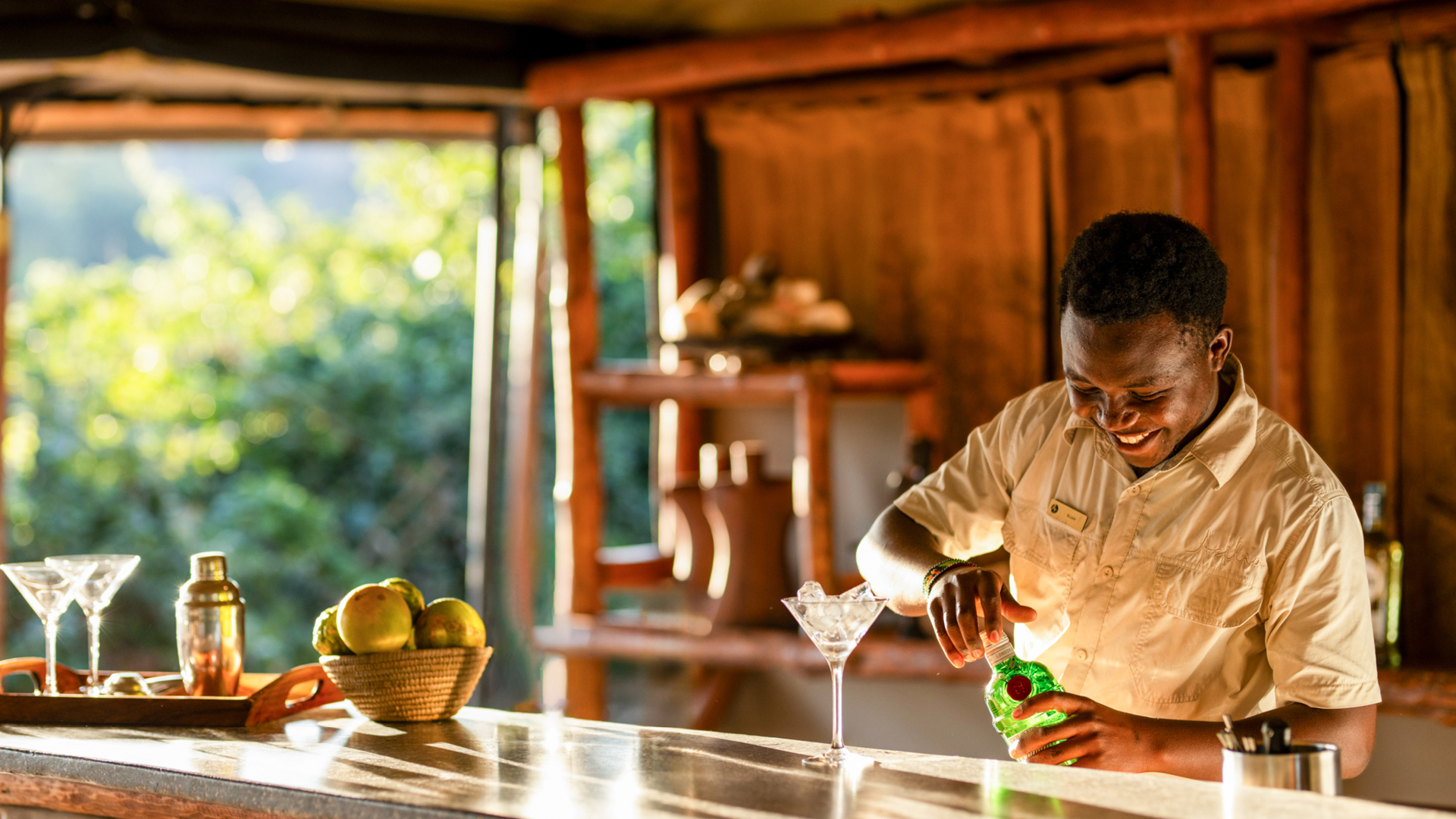 An Asilia bartender mixes a drink