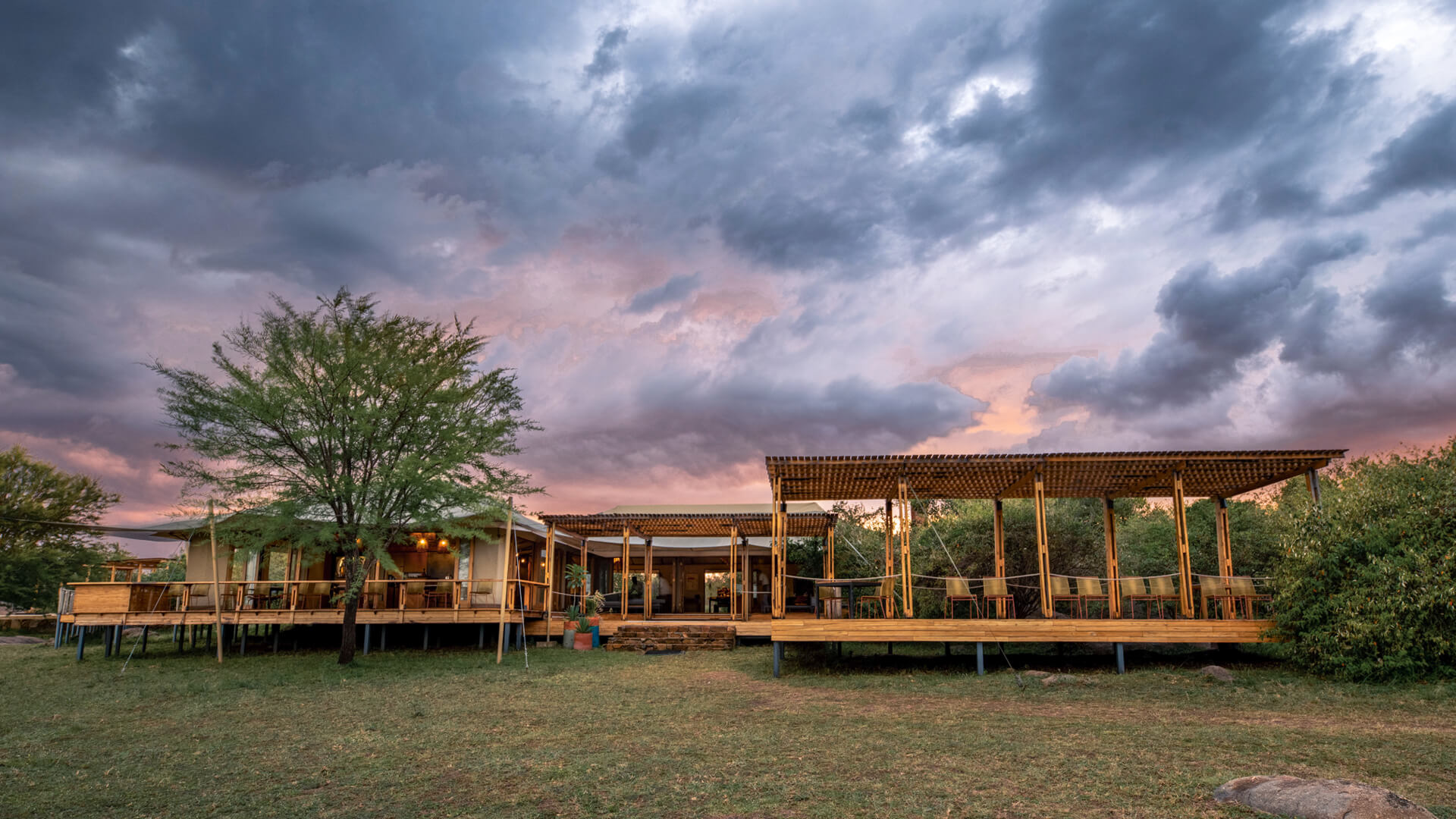 Exterior view of the lounge and bar area at Sayari Camp, northern Serengeti.