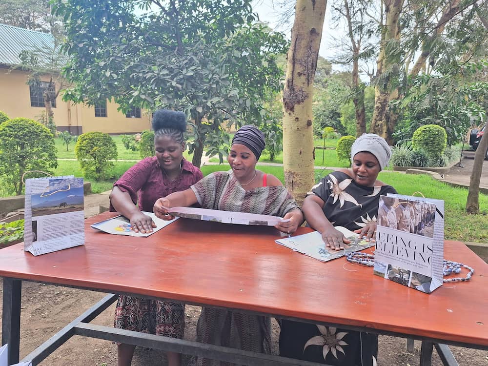 Ladies transform paper into bags and necklaces