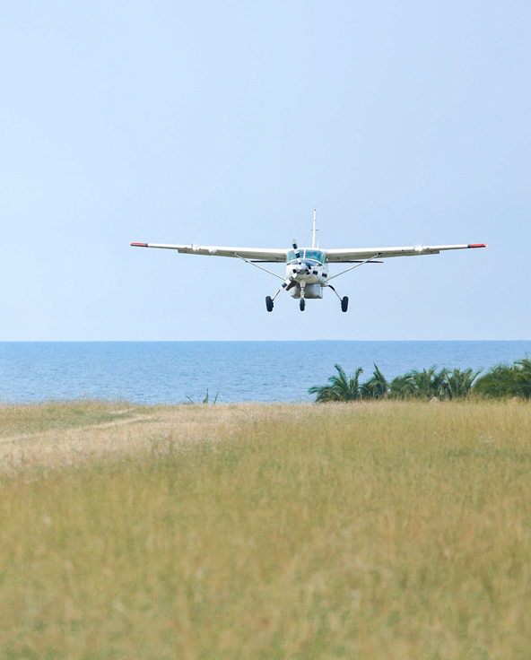 Light aircraft coming into land on Rubondo Island in northern Tanzania in East Africa