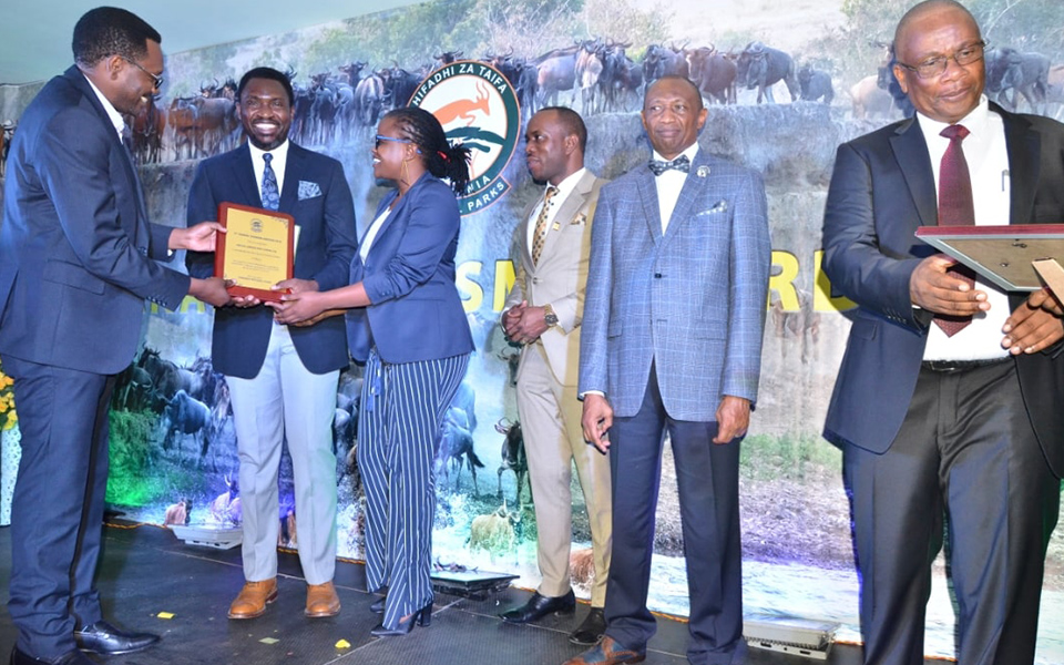 Asilia accepts the award for Best Tour Operator at the TANAPA Tourism Awards 2019.