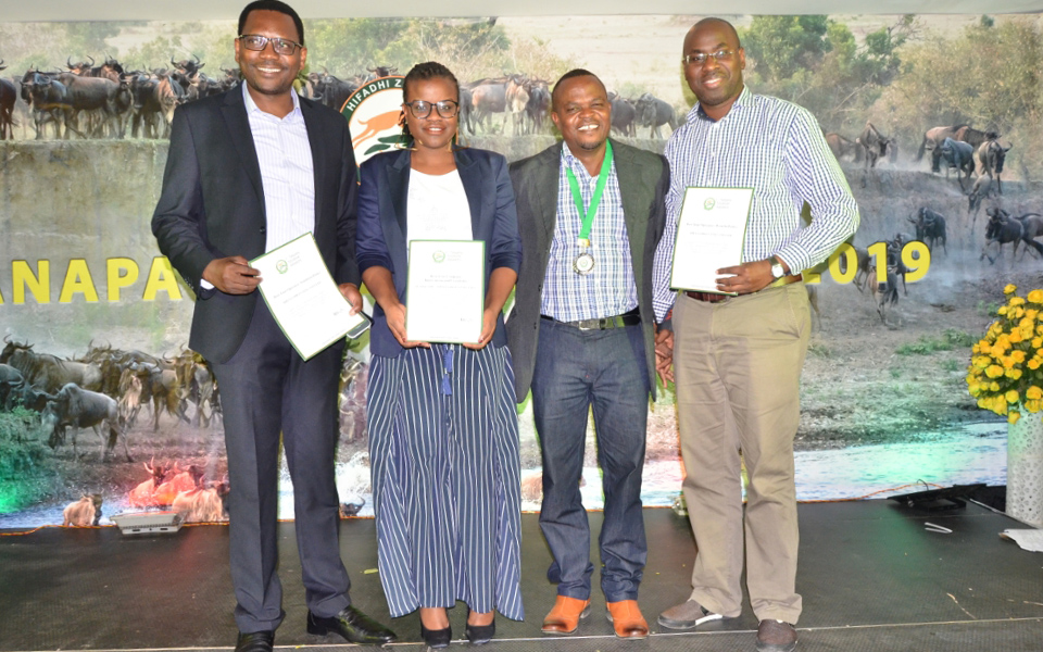 Safari guide Ayoub (third from right) accepting his award for Guide of the Year | Asilia  Africa